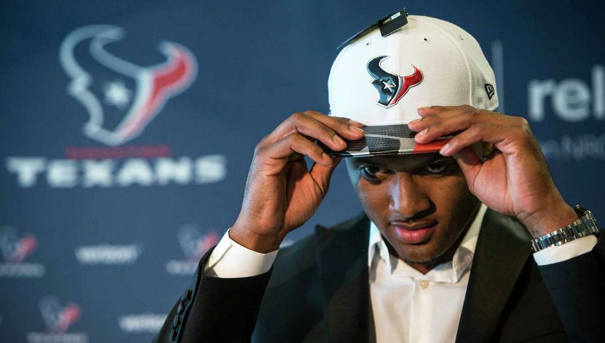 Houston Texans top draft pick Deshaun Watson dons his new Texans cap following a news conference at NRG Stadium on Friday, April 28, 2017, in Houston. The Texans traded up in the NFL Draft with the Cleveland Browns to aquire the quarterback. ( Brett Coomer / Houston Chronicle )