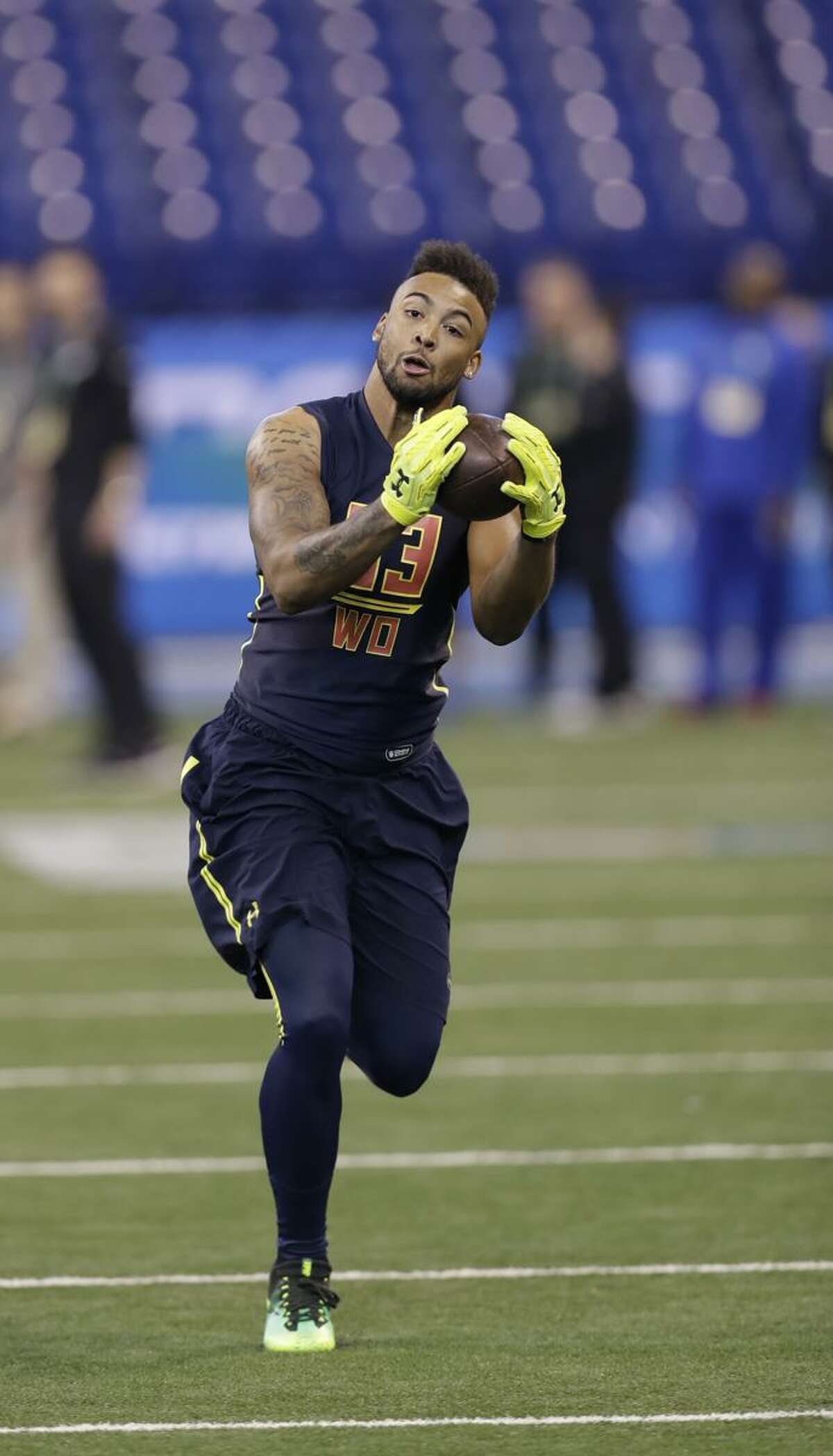Connecticut wide receiver Noel Thomas runs a drill at the NFL football scouting combine Saturday, March 4, 2017, in Indianapolis. (AP Photo/David J. Phillip)