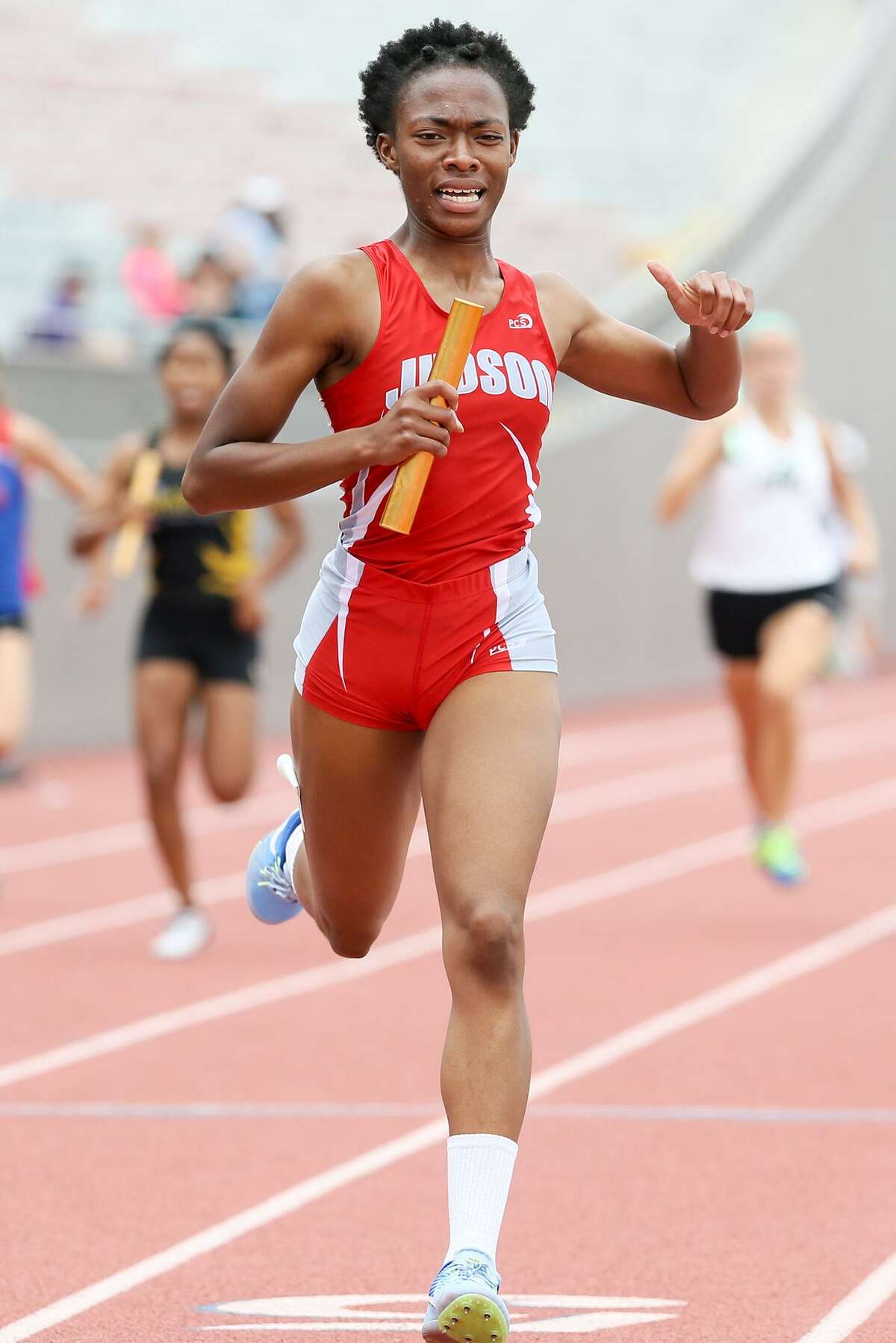 Judson's Kaleigh Dyas crosses the finish line of the 6A girls 800 meter relay during the Region IV-6A and Region IV-5A track and field championships at Alamo Stadium on April 29, 2017. The Judson girls swept the relays at the meet.