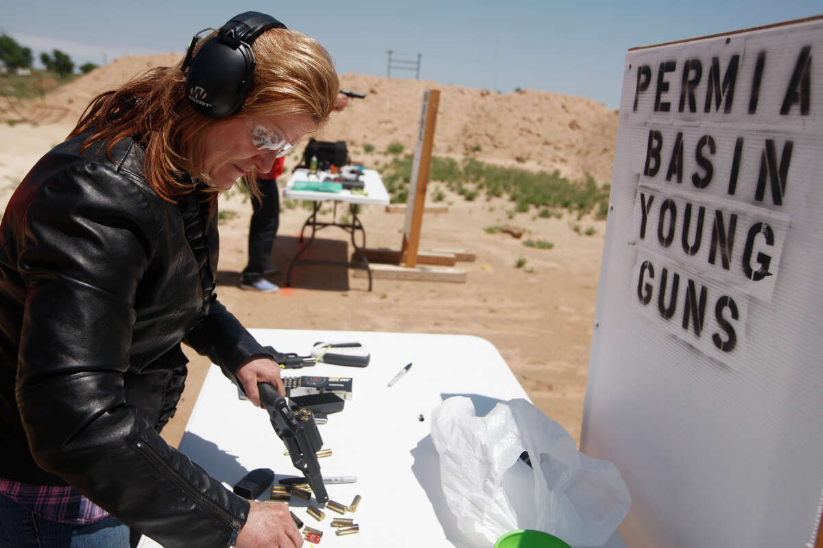 Katrina Phillips loads her revolver during a ladies handgun training class at the Permian Basin Young Guns range April 22, 2017. James Durbin/Reporter-Telegram