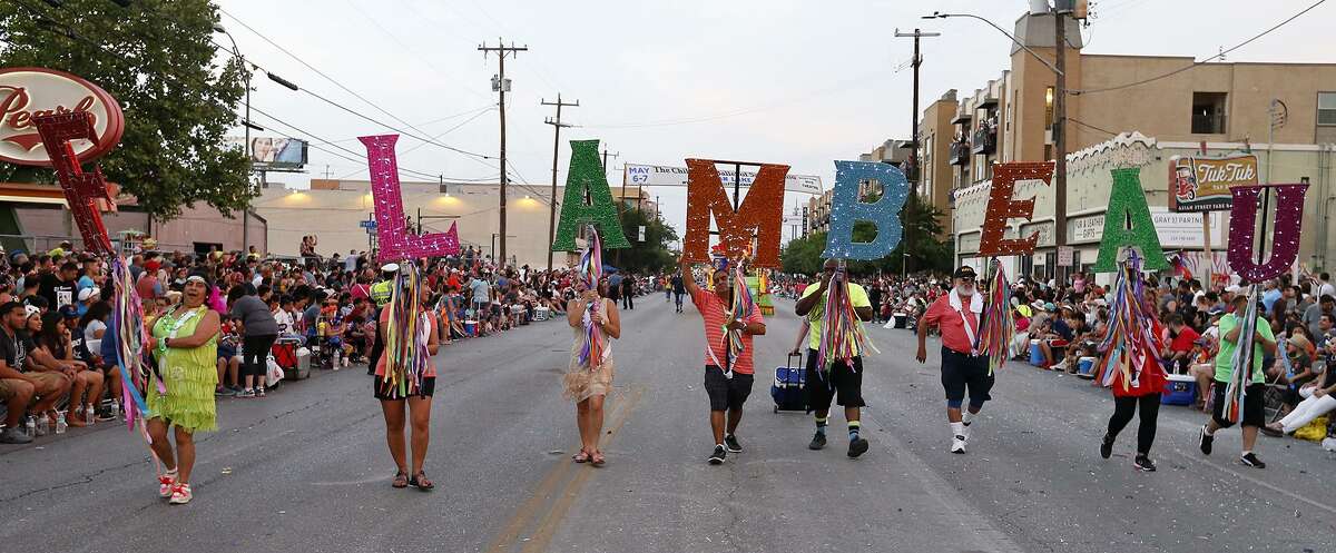 A group carries the Fiesta Flambeau Letters during the 2017 Fiesta Flambeau Parade April 29.