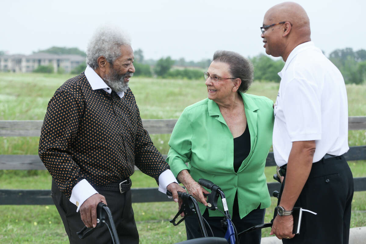 Timothy McWashington, left, and Imogene Giesinger, center, socialize along with Pastor Gregory Davis, of Mt. Sinai Baptist Church, during the dedication ceremonies for Giesinger and McWashington streets on Saturday, April 29, 2017, in Montgomery.