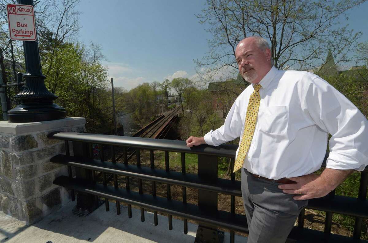 Property owner Michael McGuire speaks on the resurgence of the Wall Street district and the need for a train station in the area along the Burnell Boulevard Bridge Friday, April 28, 2017, in Norwalk, Conn. With Wall Street Theater recently opened, Head of the Harbor South nearing completion, a roof-top bar planned and a nearly completed master plan for Irving C. Freese Park, the long-planned but frustrated effort to bring the neighborhood back from the devestating 1955 flood reached critical mass.