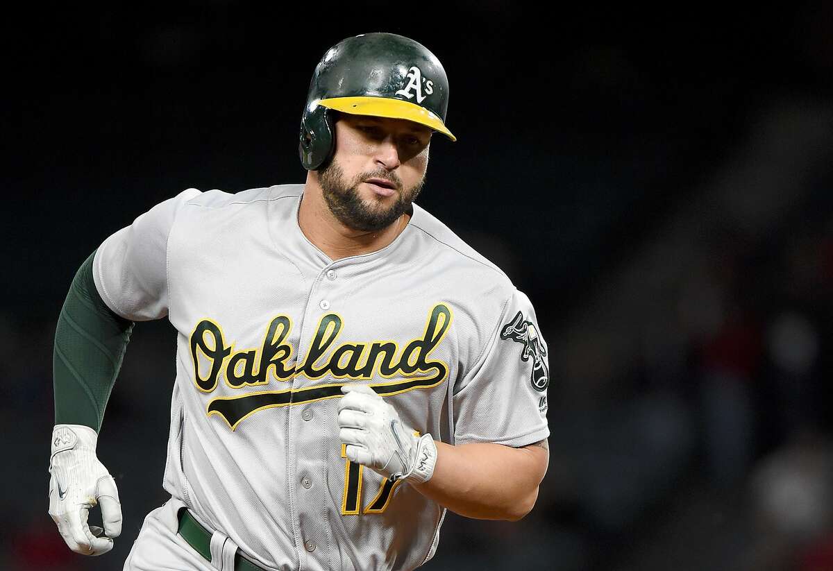 ANAHEIM, CA - APRIL 26: Yonder Alonso #17 of the Oakland Athletics runs the bases after hitting a homerun in the sixth inning against the Los Angeles Angels of Anaheim at Angel Stadium of Anaheim on April 26, 2017 in Anaheim, California. (Photo by Lisa Blumenfeld/Getty Images)