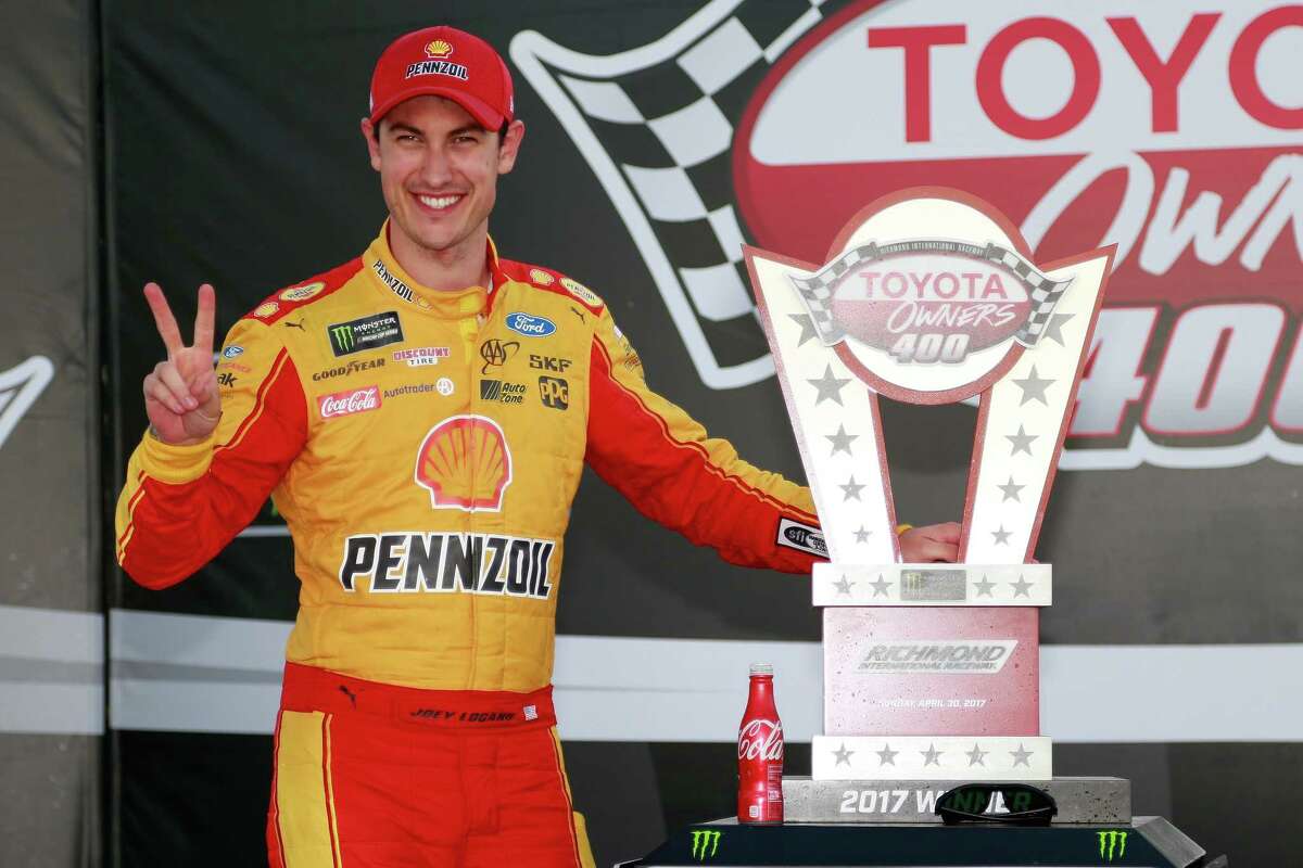 RICHMOND, VA - APRIL 30: Joey Logano, driver of the #22 Shell Pennzoil Ford, poses with the trophy in Victory Lane after winning the Monster Energy NASCAR Cup Series Toyota Owners 400 at Richmond International Raceway on April 30, 2017 in Richmond, Virginia. (Photo by Matt Sullivan/Getty Images)