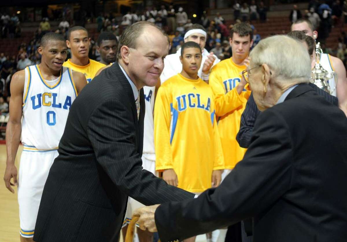 ANAHEIM, CA - DECEMBER 08: Head Coach Ben Howland of the UCLA Bruins shakes hands with John Wooden after a 75-63 win over the Davidson Wildcats during the John Wooden Classic at the Honda Center on December 8, 2007 in Anaheim, California. (Photo by Harry How/Getty Images)