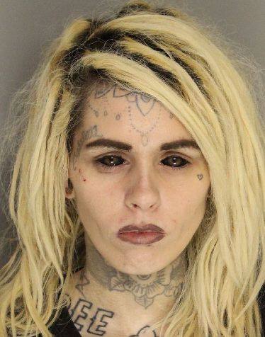 Black-eyed, blonde woman's mugshot gains attention from ...