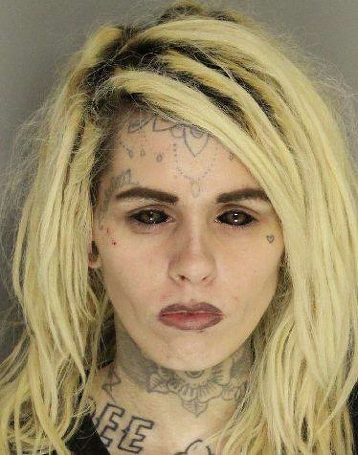 Runaway parolee with odd face and neck tattoos found