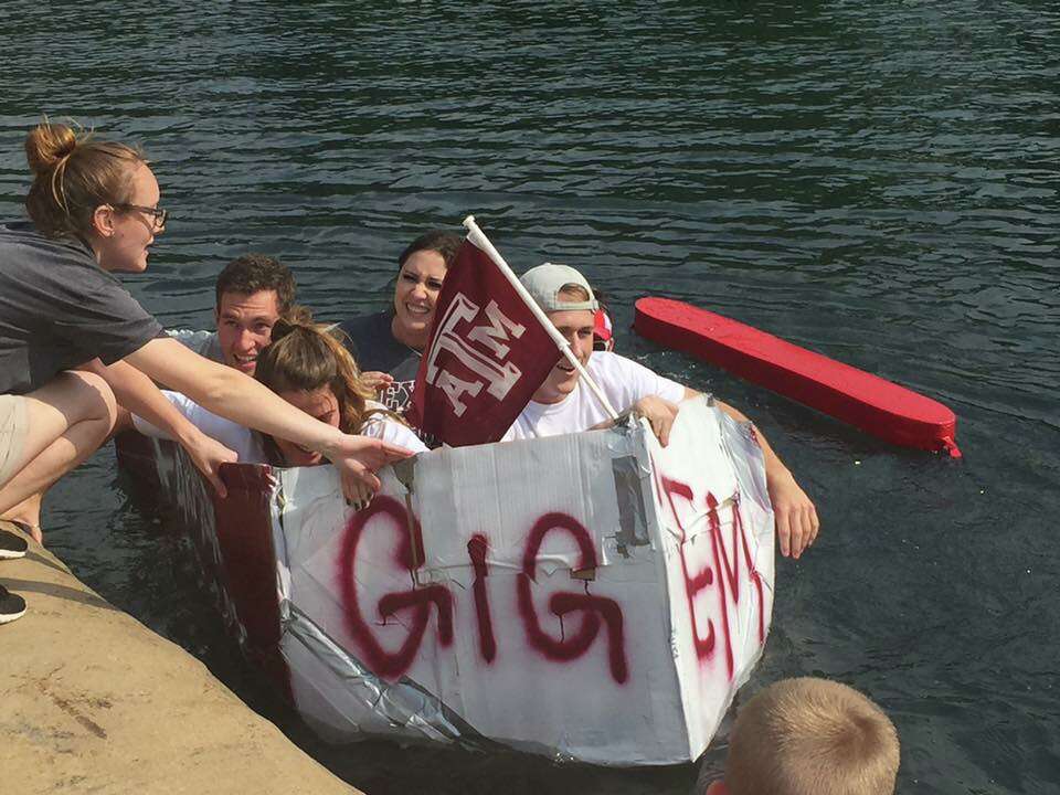 Competitors sail New Braunfels Thru the Chute Boat Race as icons