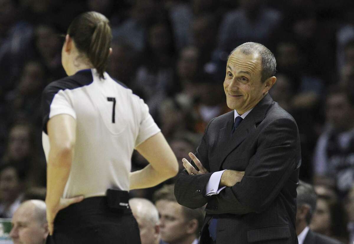 Spurs assistant Ettore Messina chats with Lauren Holtkamp.