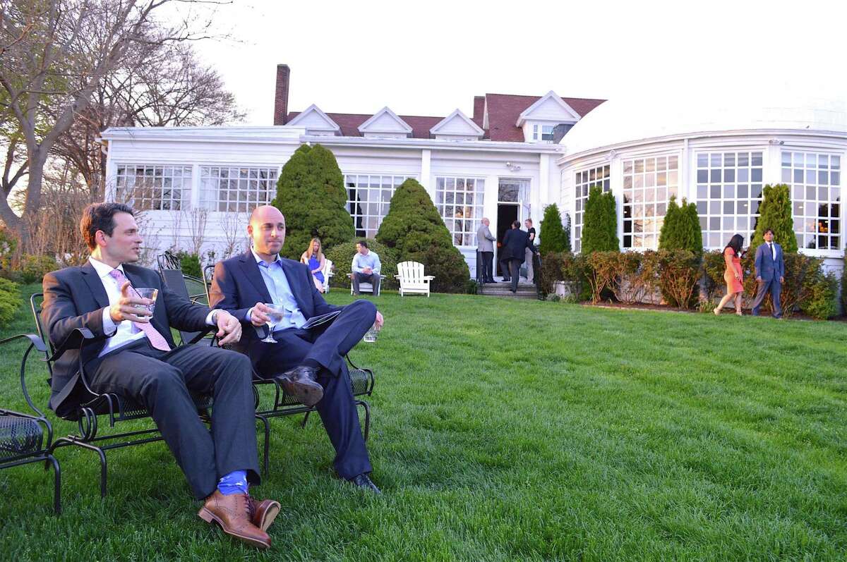Evan Remley, left, and Mike Wellen, of Fairfield, enjoys the view at the Tiny Miracles Foundation's 12th annual gala at The Inn at Longshore, Saturday, April 29, 2017, in Westport, Conn.