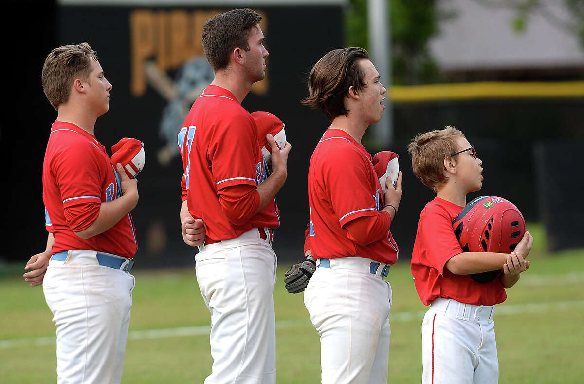 Lumberton's players line up to observe the National Anthem during their match-up in Vidor Tuesday. Each team is vying to secure a spot in the District 22-5A playoff. Vidor is currently tied with Nederland, while Lumberton is tied for second with Livingston heading into the final games of the regular season. Photo taken Tuesday, April 25, 2017 Kim Brent/The Enterprise