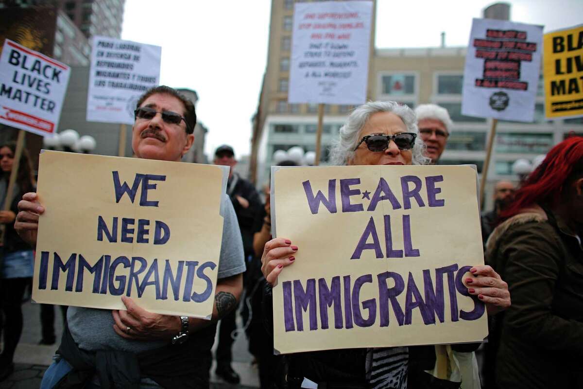 People attend a May Day rally in Union Square in New York. In the United States, protesters vowed to participate in civil disruptions throughout the day to draw attention to the importance of immigrants in American communities.