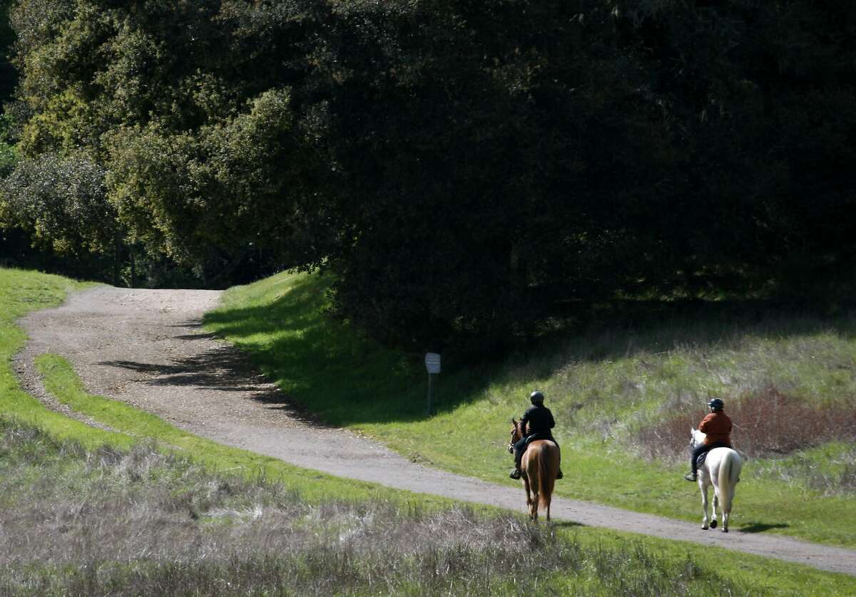 Two equestrians head out for a sunny day of riding on the Bear Valley Trail at Point Reyes National Seashore in Point Reyes, Calif., on Thursday, April 1, 2010.