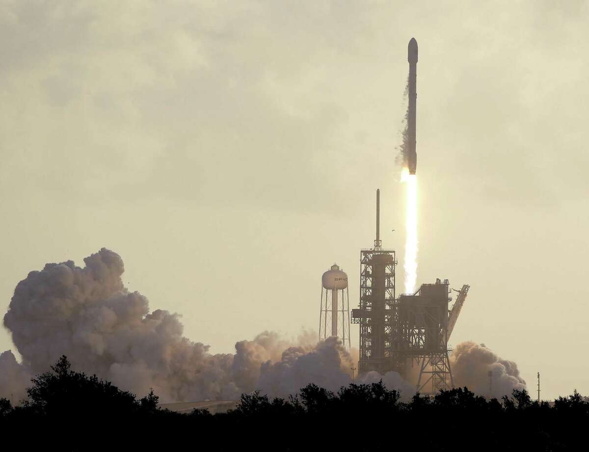 A Falcon 9 SpaceX rocket carrying a classified satellite for the National Reconnaissance Office lifts off at the Kennedy Space Center in Cape Canaveral, Fla.