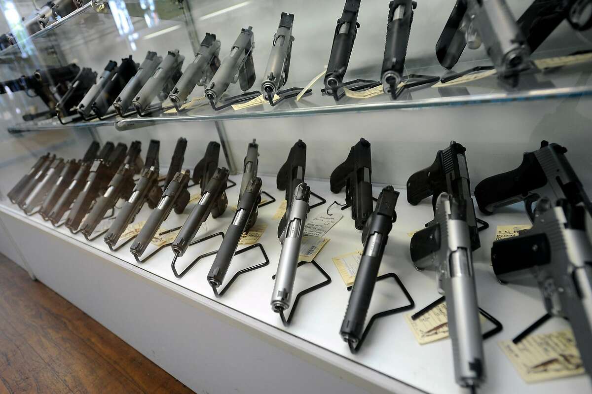 Handgun's are seen in a display case at Gary Kolander's shop Gun Vault in Mountain View, CA Wednesday July 25th, 2012.