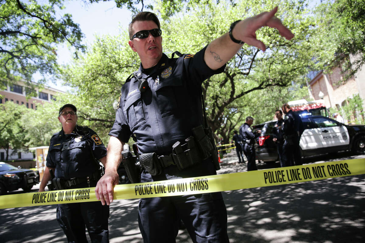 Law enforcement officers secure the scene after a fatal stabbing attack on the University of Texas campus Monday, May, 1, 2017.