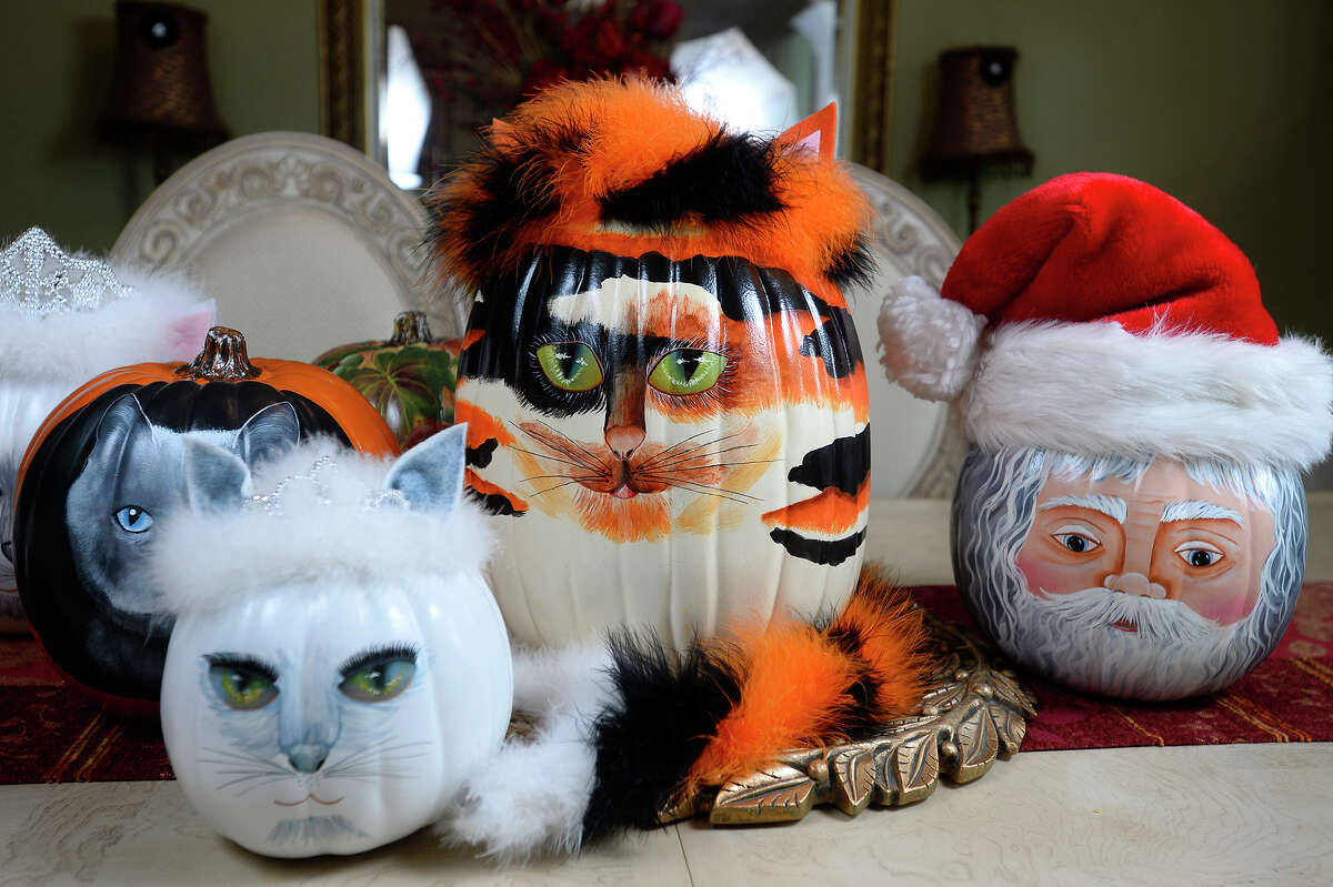 Linda Landrum creates a variety of cats and other characters on foam pumpkins for sale in an Etsy store called MyFancyFare. Landrum, who has painted all her life, said she tries to find unique things to make. "To do well, you really have to pick something no one else is doing," she said. Photo taken Wednesday 4/19/17 Ryan Pelham/The Enterprise