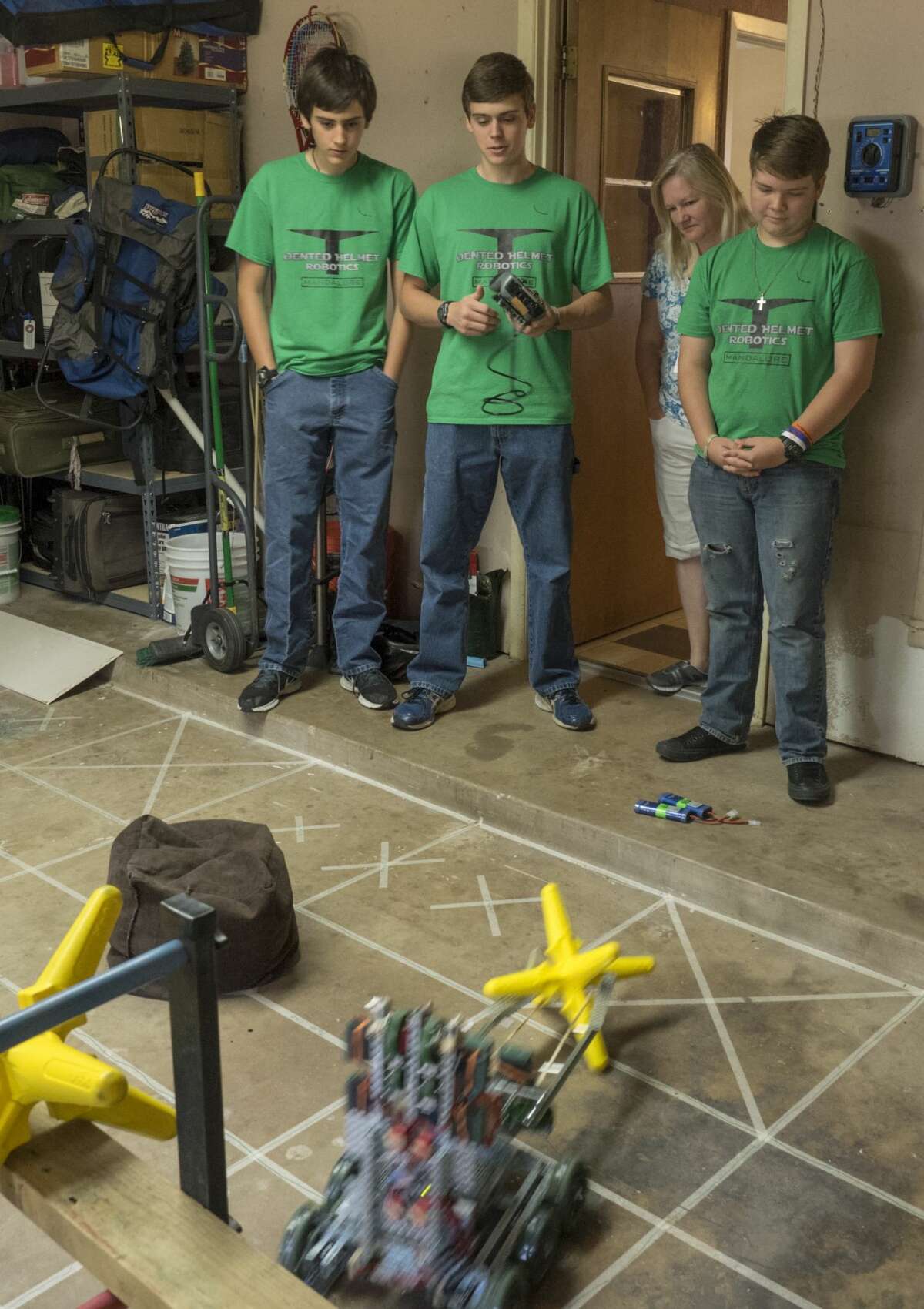 Conner Stringham, his brother Brandon, and Caleb Anderson show off their robot, Mandalore, 4/27/17 they used to compete in the World Tournament for VEX robotics. Tim Fischer/Reporter-Telegram