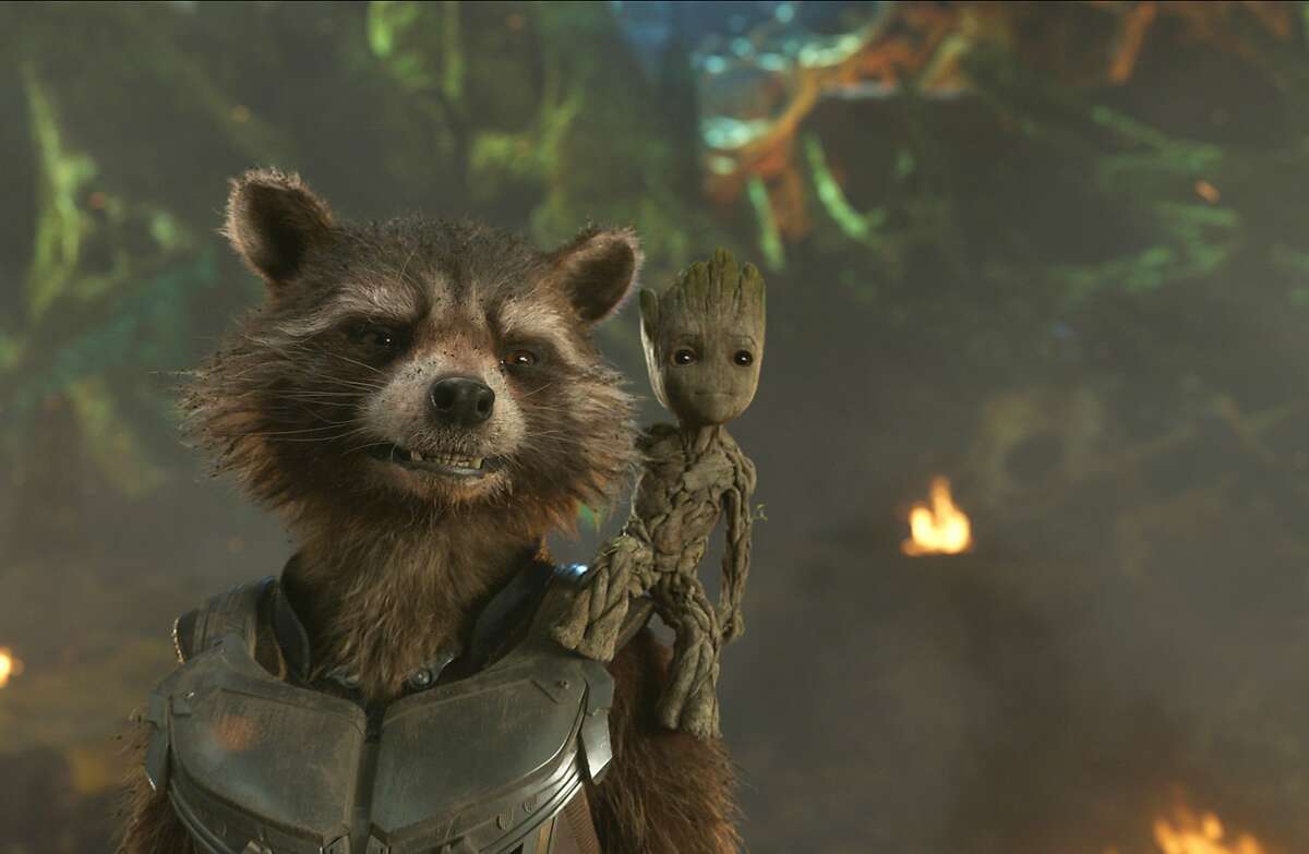 This image released by Disney shows the Rocket, voiced by Bradley Cooper, left, and Groot, voiced by Vin Diesel in a scene from Marvel's "Guardians Of The Galaxy Vol. 2." (Marvel Studios/Disney via AP)