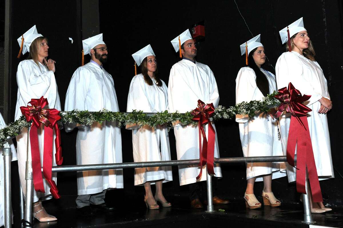 Members of the final graduating classes of the Bridgeport Hospital School of Nursing, representing December 2016 and May 2017, line up to receive their diplomas during commencement exercises held at the University of Bridgeport on Monday.