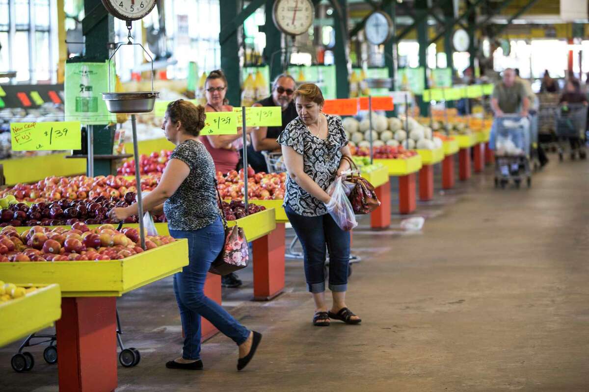 Shoppers browse through the produce at Canino Produce Inc., Farmers Outlet in the 2500 block of Arline on Monday, May 1, 2017, in Houston. A local developer is under contract to purchase the farmer's market property in the Heights area. The group says the market will stay, but improvements are planned that will affect the property in the long term. ( Brett Coomer / Houston Chronicle )