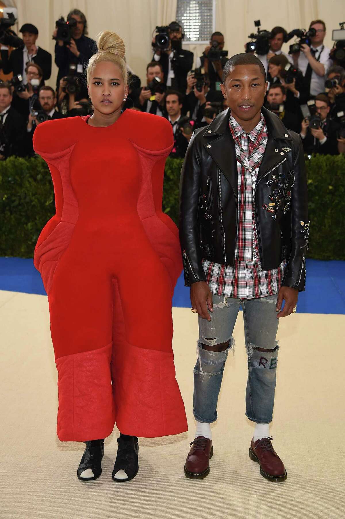 STOP IT: Helen Lasichanh and co-chair Pharrell Williams. Let's start with his too-small clothes, and her cartoon getup.