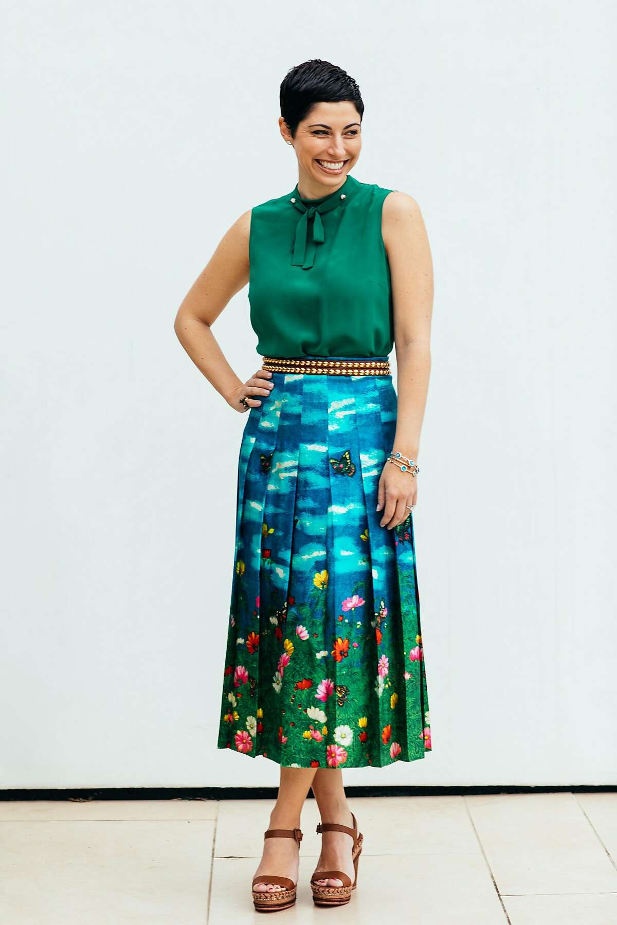 Chrisa Pappas of Sacramento writes a blog called Chrisascut and operates a consignment clothing store online -- www.thestylespin.com -- selling designer apparel from her personal collection. �Here, she wears a Gucci green top and floral skirt, Burberry belt and Christian Louboutin shoes.