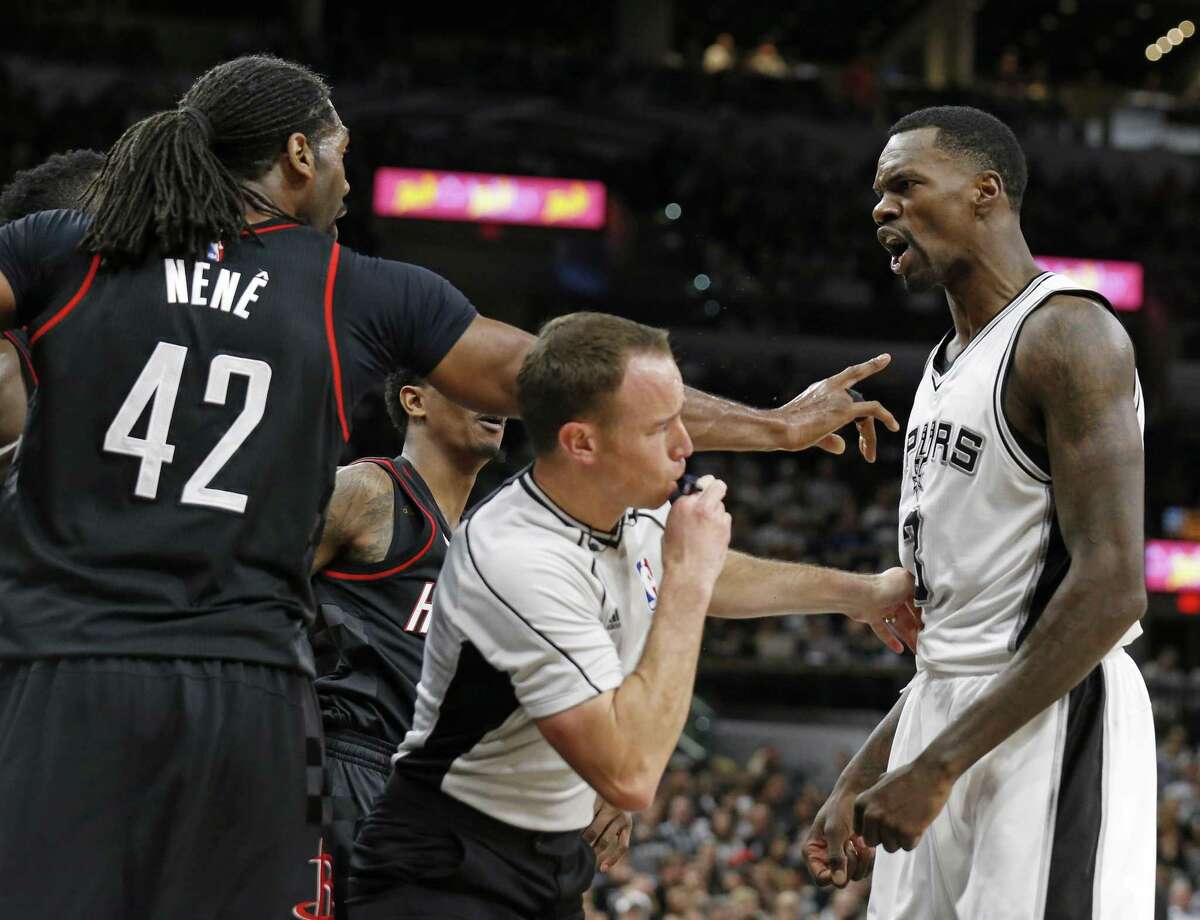 Houston Rockets’ Nene and the Spurs’ Dewayne Dedmon argue as official Josh Tiven moves in at the end of the third quarter during Game 1 on May 1, 2017 at the AT&T Center. Nene was ejected.