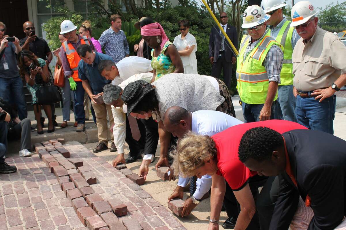 Mayor Sylvester Turner lays a brick as part of a ceremony to kick off the re-installation of historic bricks made by freed slaves in Houston's Freedmen's Town on Friday, April 28, 2017. The following week it turned out many of the bricks were not original. (Courtesy of City of Houston)