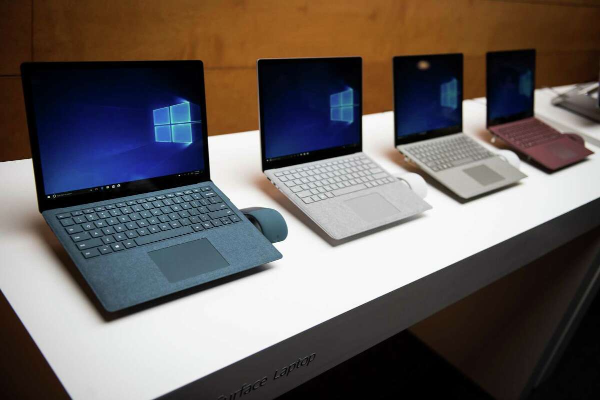 Microsoft Corp. introduced a slim, $999 laptop, its latest push into hardware and a bid to steal Apple Inc.'s college student customers. The device comes in four colors, gold, platinum, blue and burgundy.