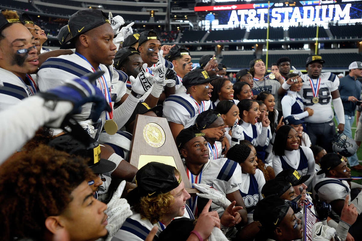 West Orange-Stark players celebrate after beating Sweetwater in the Class 4A-Division II state final at AT&T Stadium in Dallas on Friday. Photo taken Friday 12/16/16 Ryan Pelham/The Enterprise