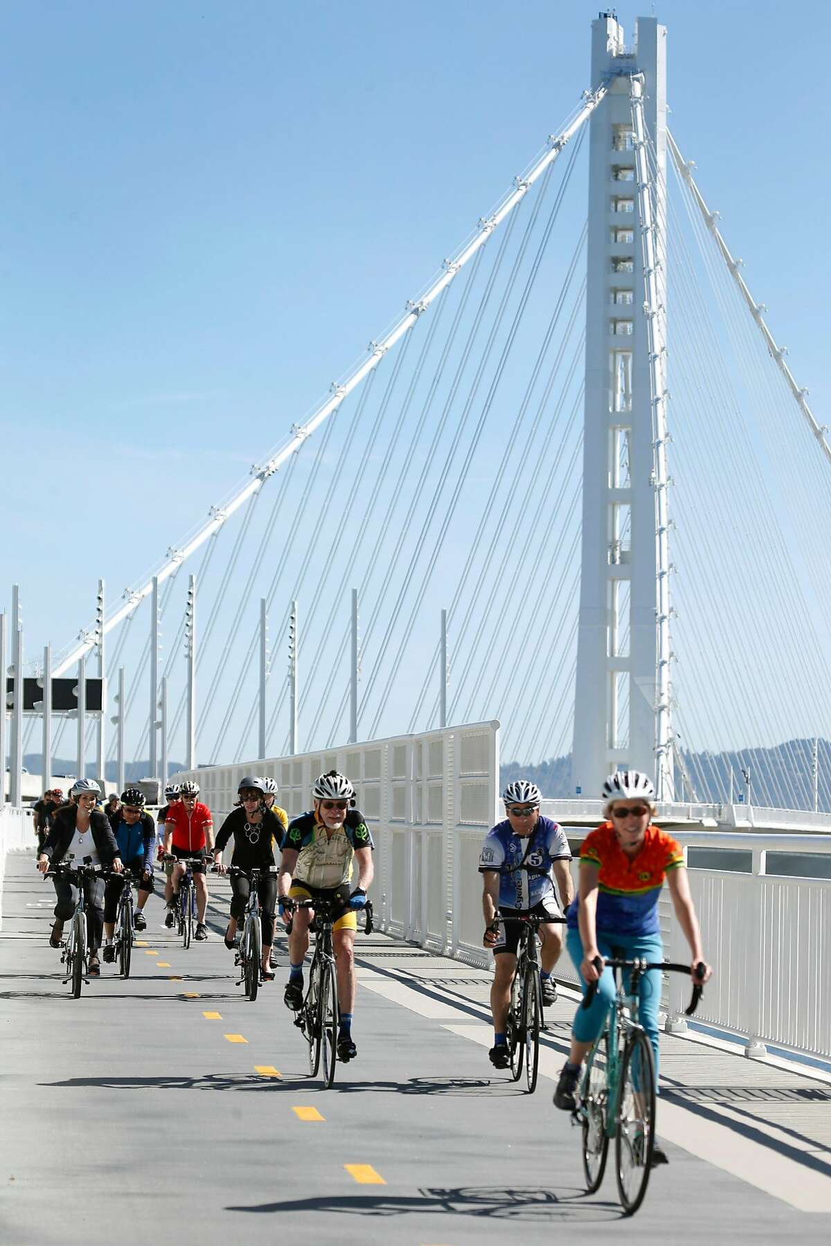 A group of bicyclists, including Oakland Mayor Libby Schaaf, approaches Yerba Buena Island after starting from Oakland on the Bay Bridge Bike Path in San Francisco, Calif. on Tuesday, May 2, 2017. Transportation officials dedicated a new vista point overlooking the new eastern span and the East Bay on the same day the 2.2 mile bike and pedestrian path opened on weekdays making it accessible 7 days a week.