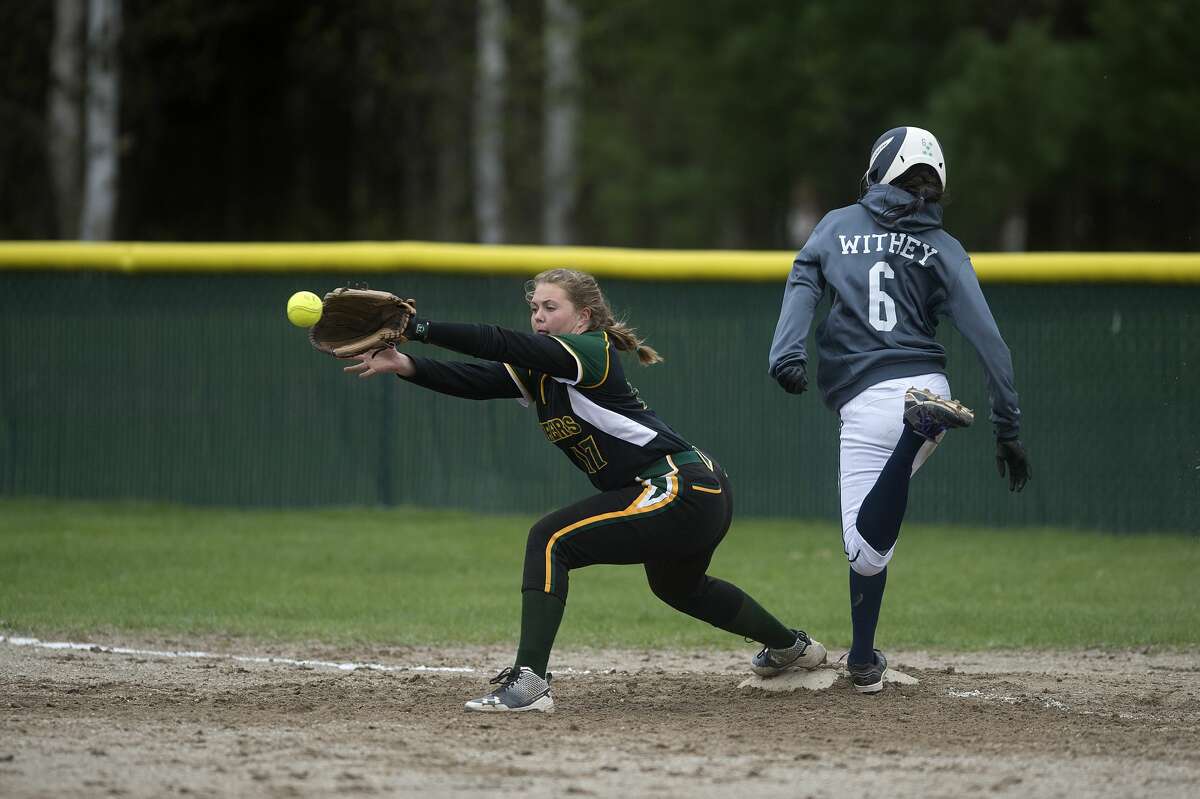 Lapeer's Brooklyn Withey touches first before before Dow High's Baylee Rohn can get her out in the third inning of the Tuesday afternoon game.