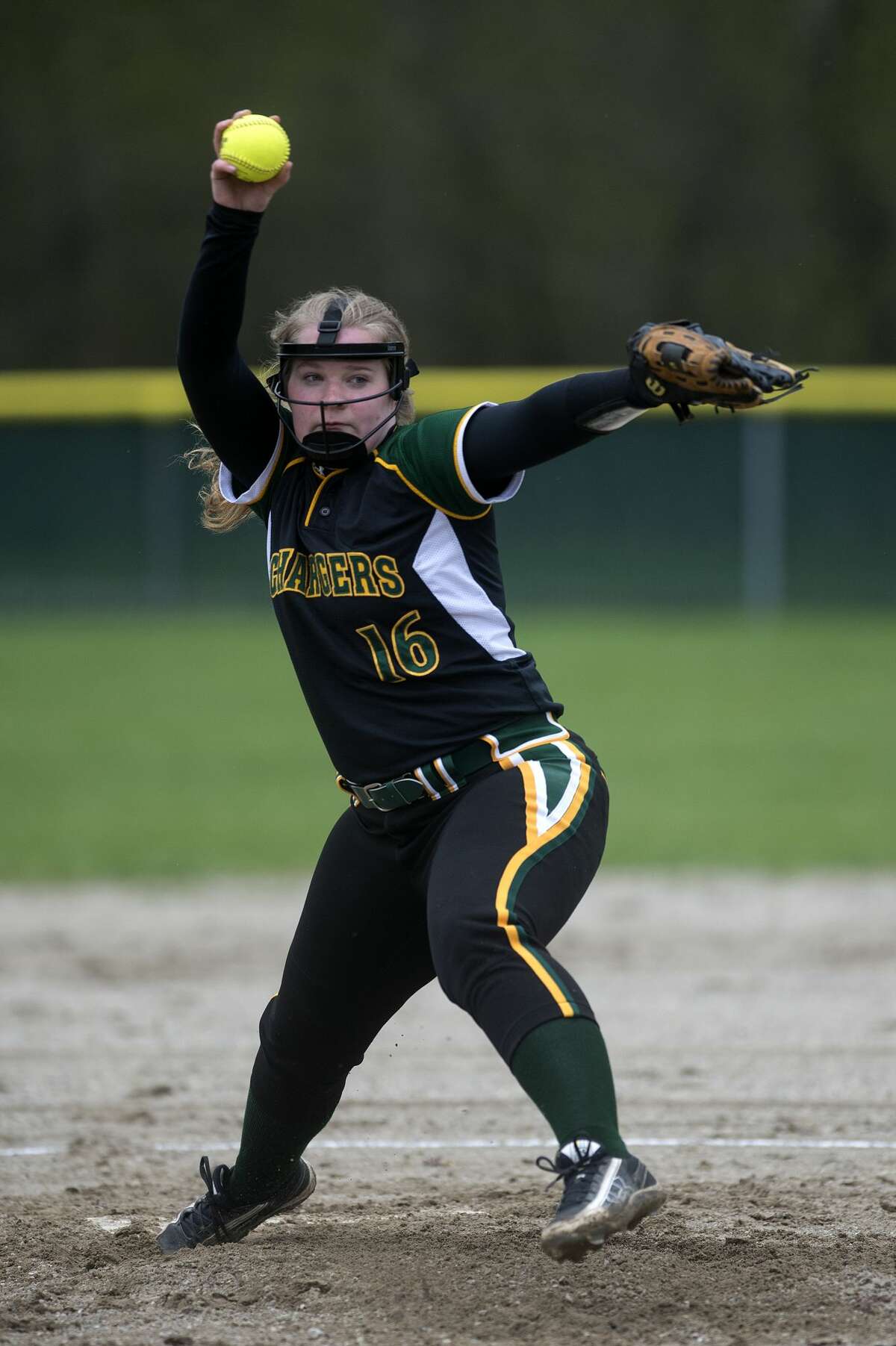 Dow High's Grace Pnacek pitches in the first inning of Dow's home game against Lapeer High School Tuesday afternoon.