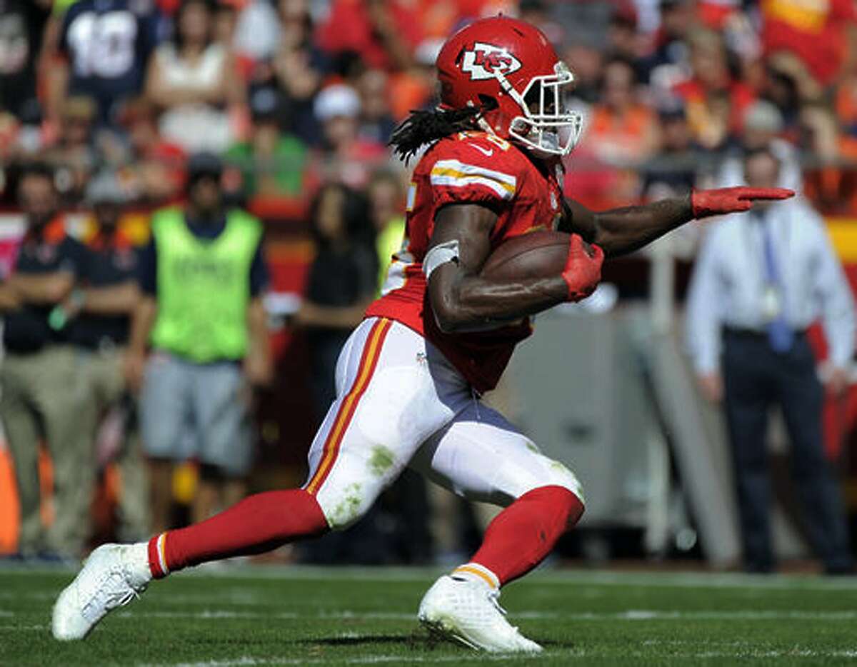 FILE- In this Oct. 11, 2015, file photo, Kansas City Chiefs running back Jamaal Charles carries the ball during the second half of an NFL football game against the Chicago Bears in Kansas City, Mo. Charles is scheduled to visit with the Denver Broncos on Tuesday, May 2, 2017. If his surgically repaired right knee checks out, Charles could be joining their fierce divisional rival. (AP Photo/Ed Zurga, File)