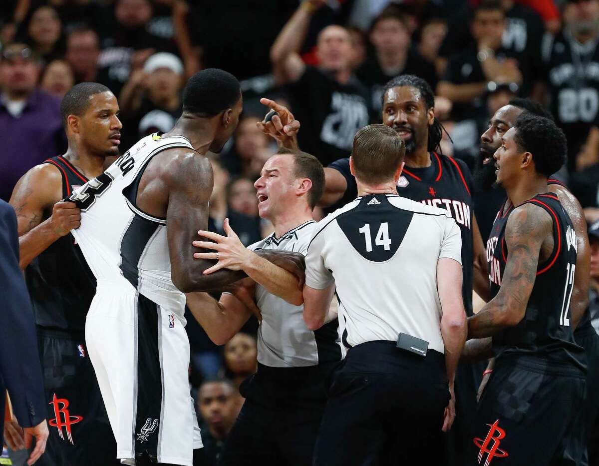 Officials try to create space during an altercation between Spurs center Dewayne Dedmon (left) and Houston Rockets center Nene (pointing finger) during the second half of Game 1 at the AT&T Center on May 1, 2017, in San Antonio. Nene was ejected from the game for putting his hand on Dedmon’s throat.