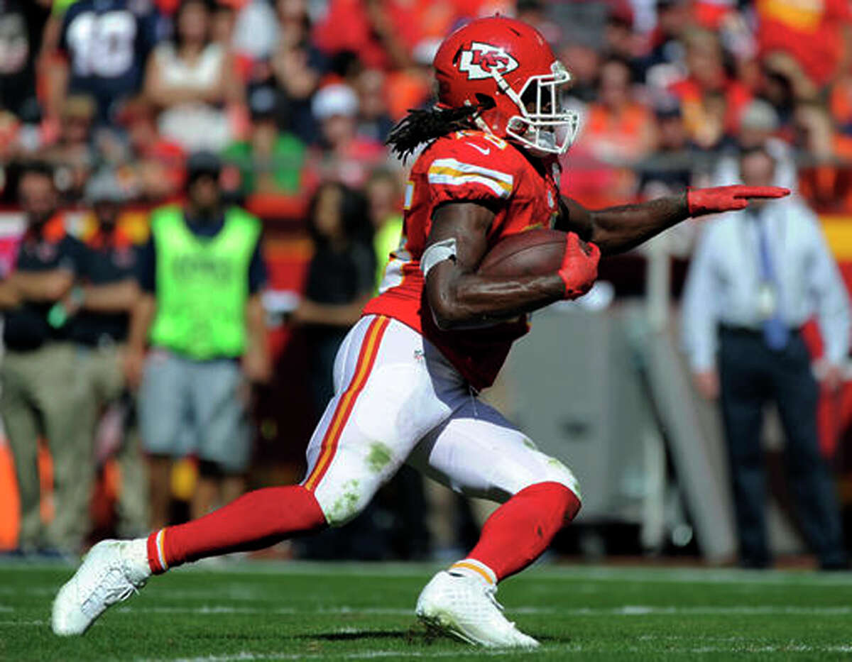 FILE- In this Oct. 11, 2015, file photo, Kansas City Chiefs running back Jamaal Charles carries the ball during the second half of an NFL football game against the Chicago Bears in Kansas City, Mo. Charles is scheduled to visit with the Denver Broncos on Tuesday, May 2, 2017. If his surgically repaired right knee checks out, Charles could be joining their fierce divisional rival. (AP Photo/Ed Zurga, File)