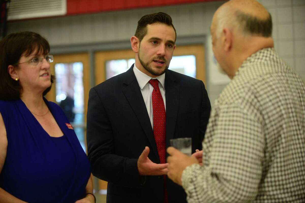 J.R. Romano, State GOP chairman and Derby native chats with Ed Greenberg and congressional candidate Daria Novak at the Trump Rally at Sacred Heart University Saturday, August 13, 2016 in Fairfield, Conn.