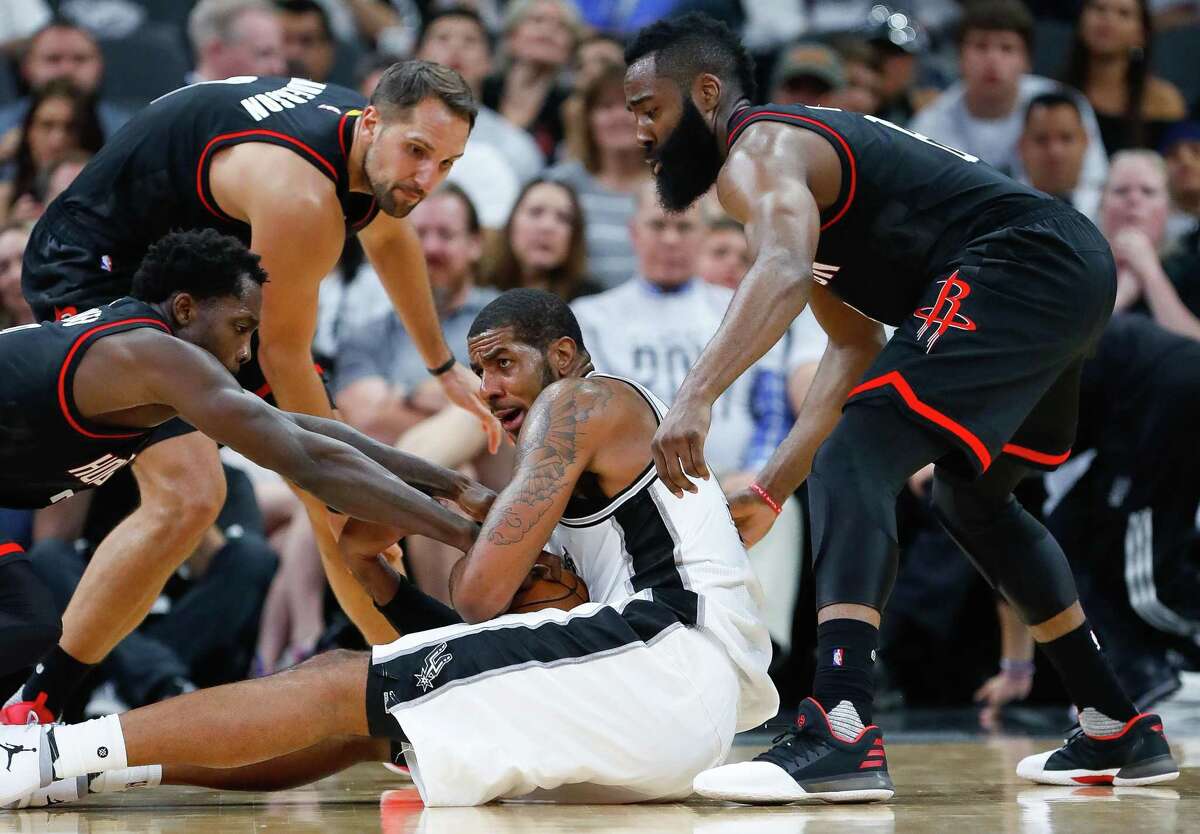 Spurs forward LaMarcus Aldridge tries to hold onto a loose ball during the second half of Game 1 at the AT&T Center on May 1, 2017, in San Antonio.