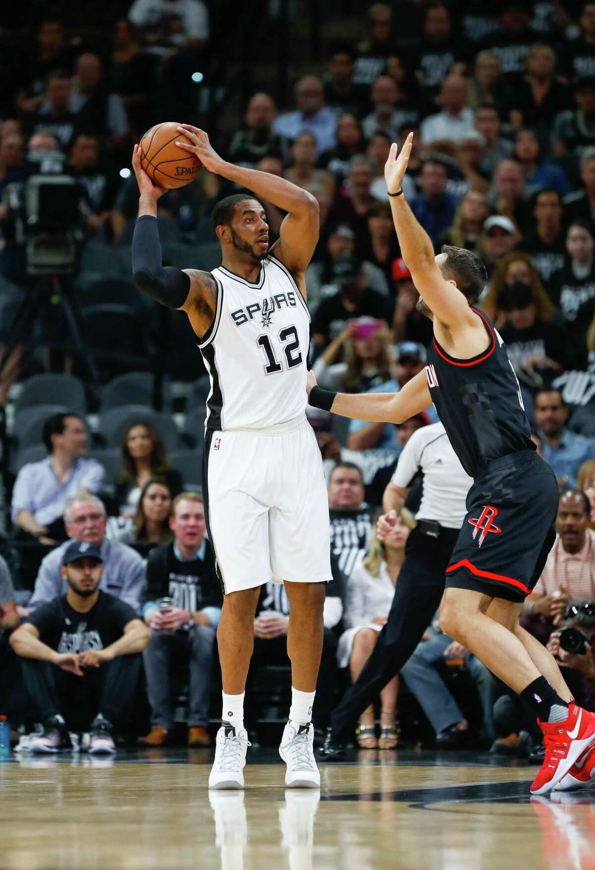 Spurs forward LaMarcus Aldridge is guarded by Houston Rockets forward Ryan Anderson during the first half of Game 1 at the AT&T Center on May 1, 2017, in San Antonio.