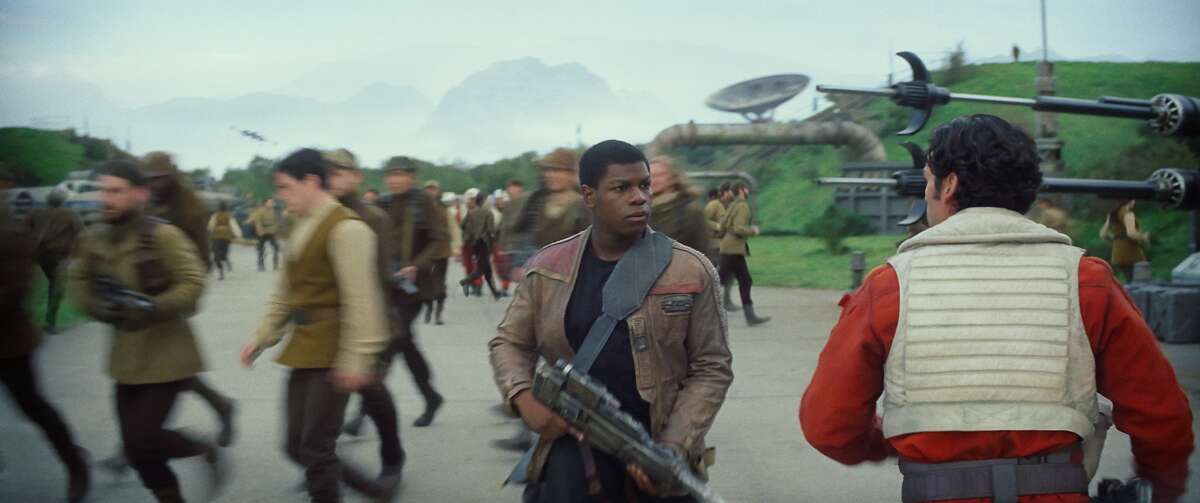 Star Wars: The Force Awakens L to R: Finn (John Boyega) and Poe Dameron (Oscar Isaac) Ph: Film Frame © 2014 Lucasfilm Ltd. & TM. All Right Reserved..