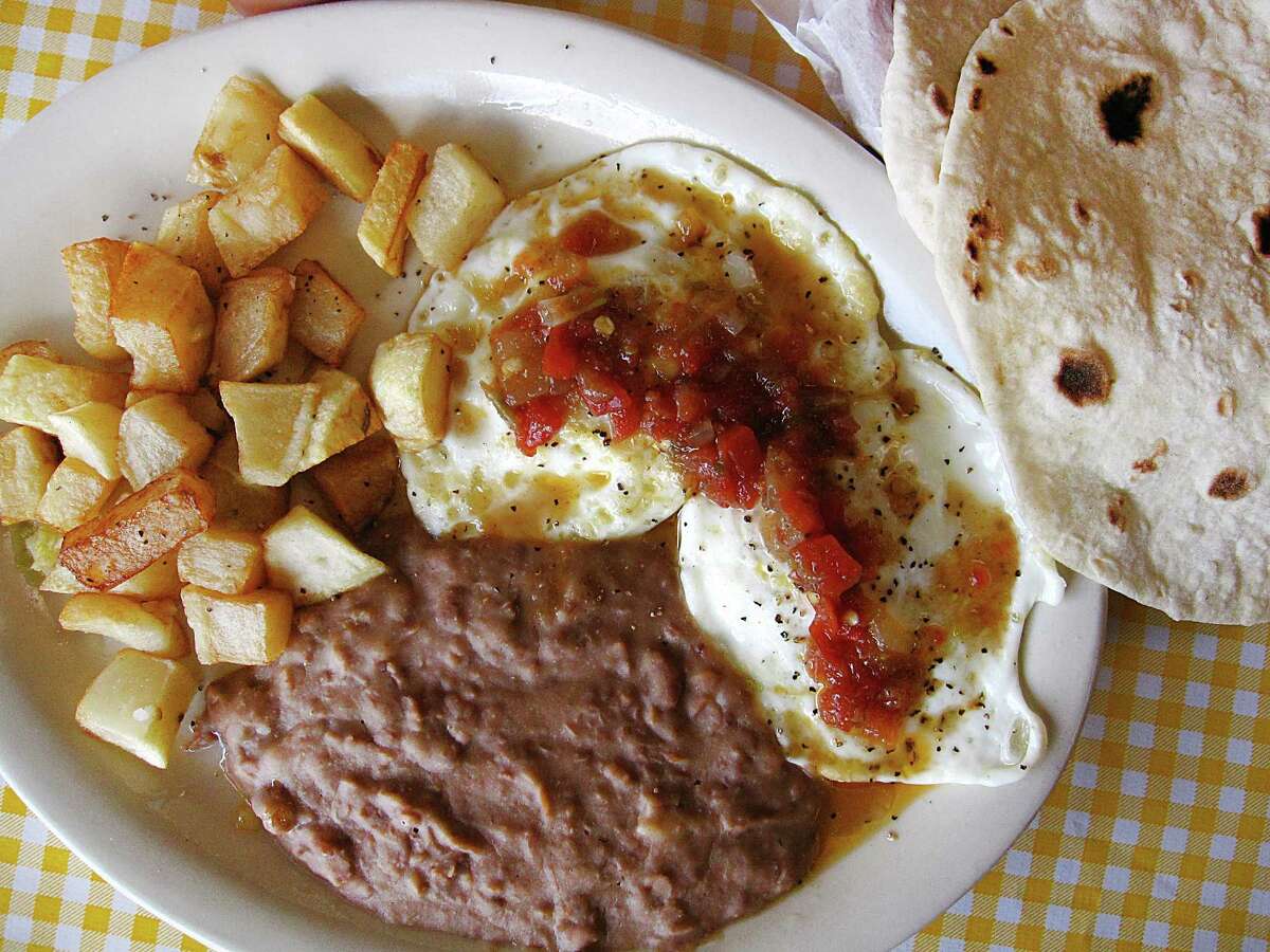 Huevos rancheros plate with handmade flour tortillas from Mi Ranchito.