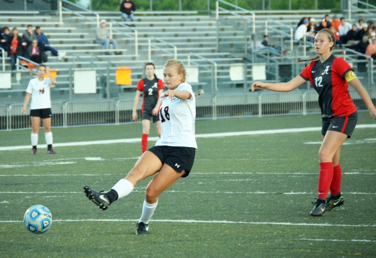 Edwardsville senior Abby Crabtree scores late in the first half of Tuesday’s Southwestern Conference game against Alton.