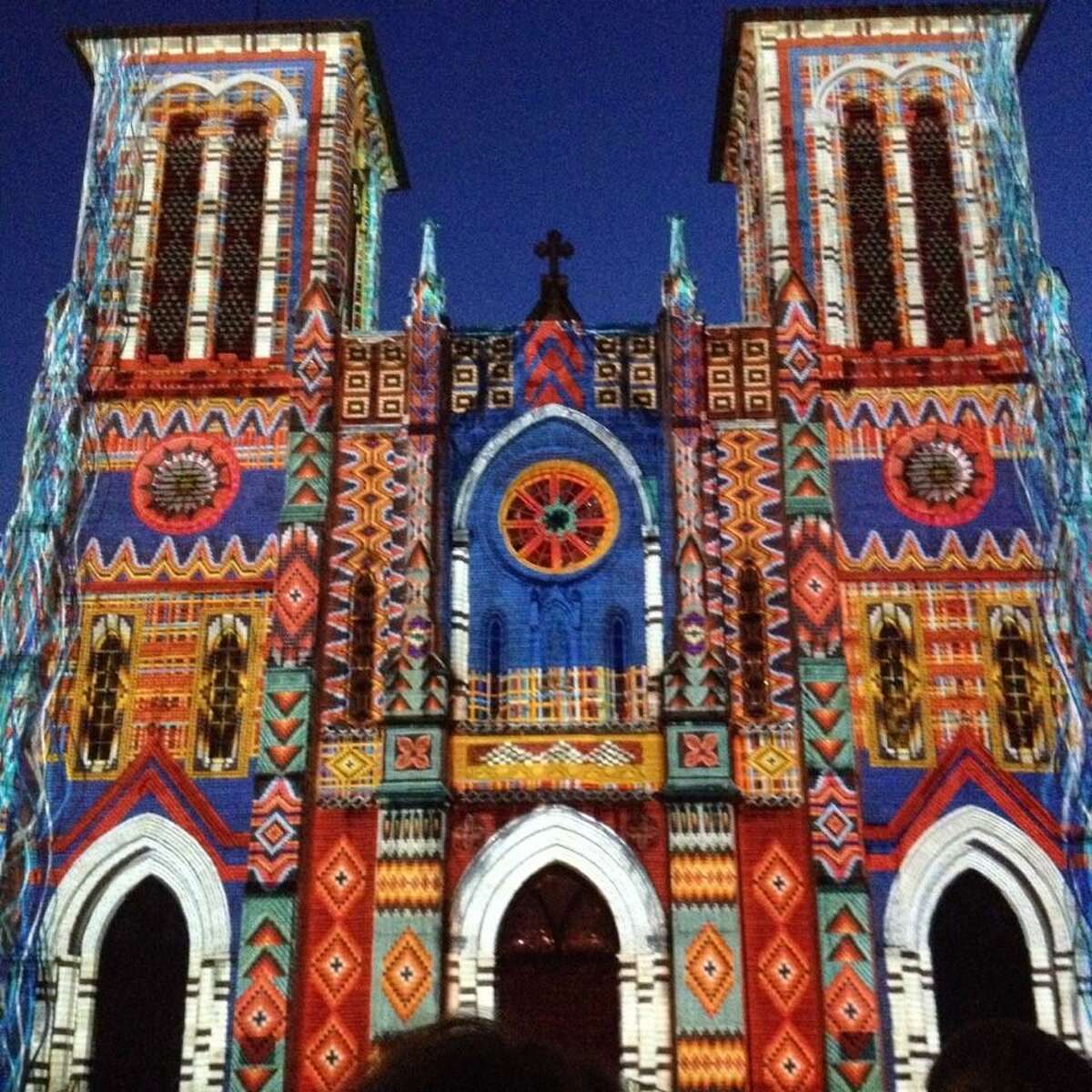 A photo of the downtown art installment “The Saga” projected on San Fernando Cathedral.