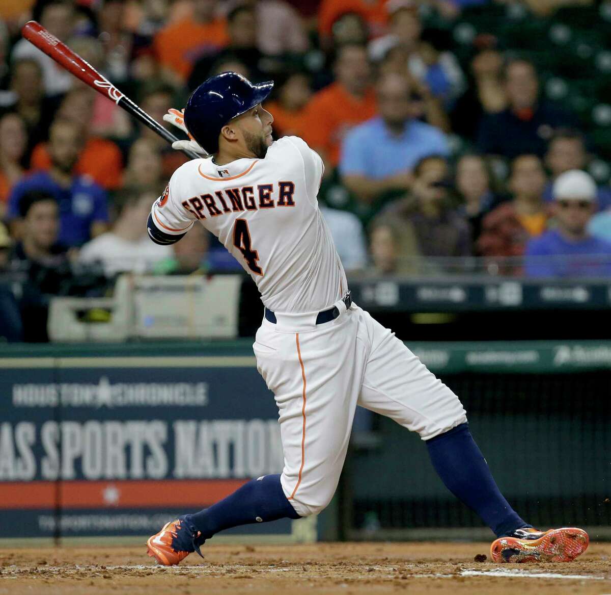 Houston Astros George Springer hits a RBI single against the Texas Rangers during the second inning at Minute Maid Park Wednesday, May 3, 2017, in Houston. Alex Bregman scored on the hit.
