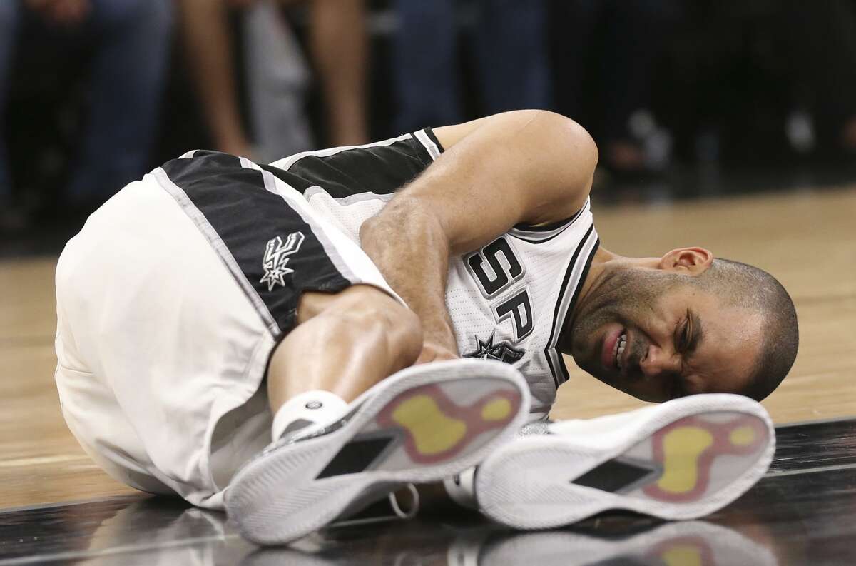 San Antonio Spurs?’ Tony Parker holds his left knee during the fourth quarter of game two in the Western Conference semifinals against the Houston Rockets at the AT&T Center, Wednesday, May 3, 2017.