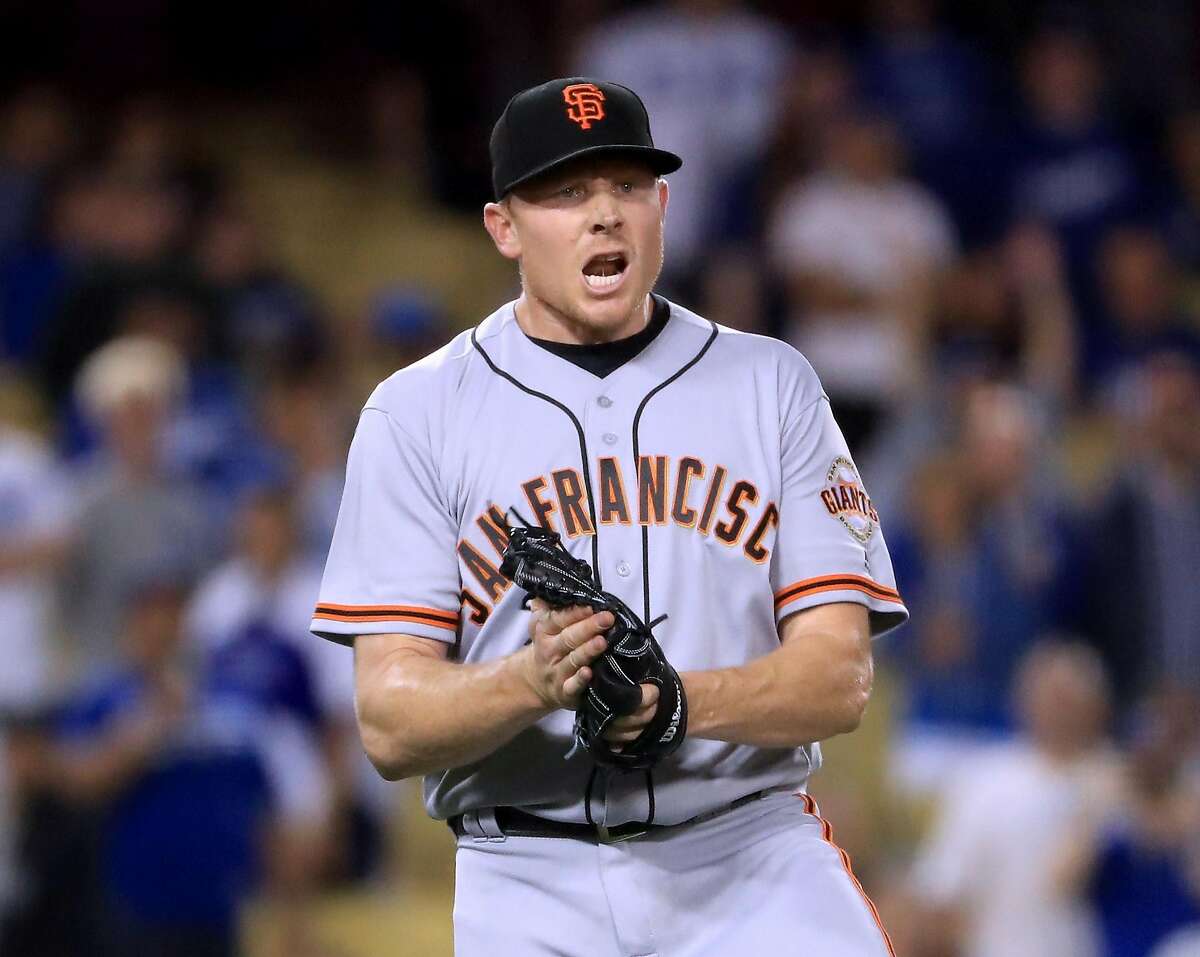 LOS ANGELES, CA - MAY 03: Mark Melancon #41 of the San Francisco Giants celebrates the final Los Angeles Dodgers out for a 4-1 win during the 11th inning at Dodger Stadium on May 3, 2017 in Los Angeles, California. (Photo by Harry How/Getty Images)
