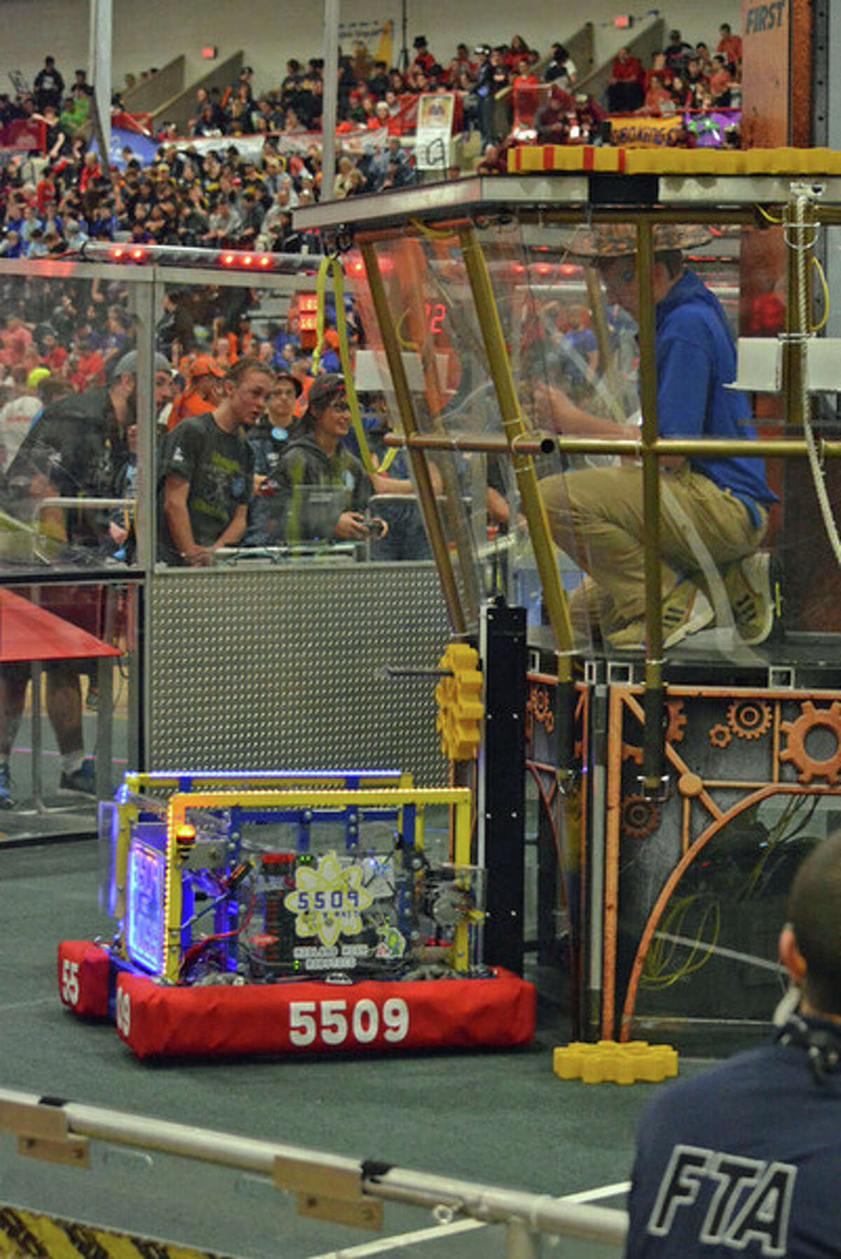 The robot from Midland High's Team 5509 delivering a gear during competition.