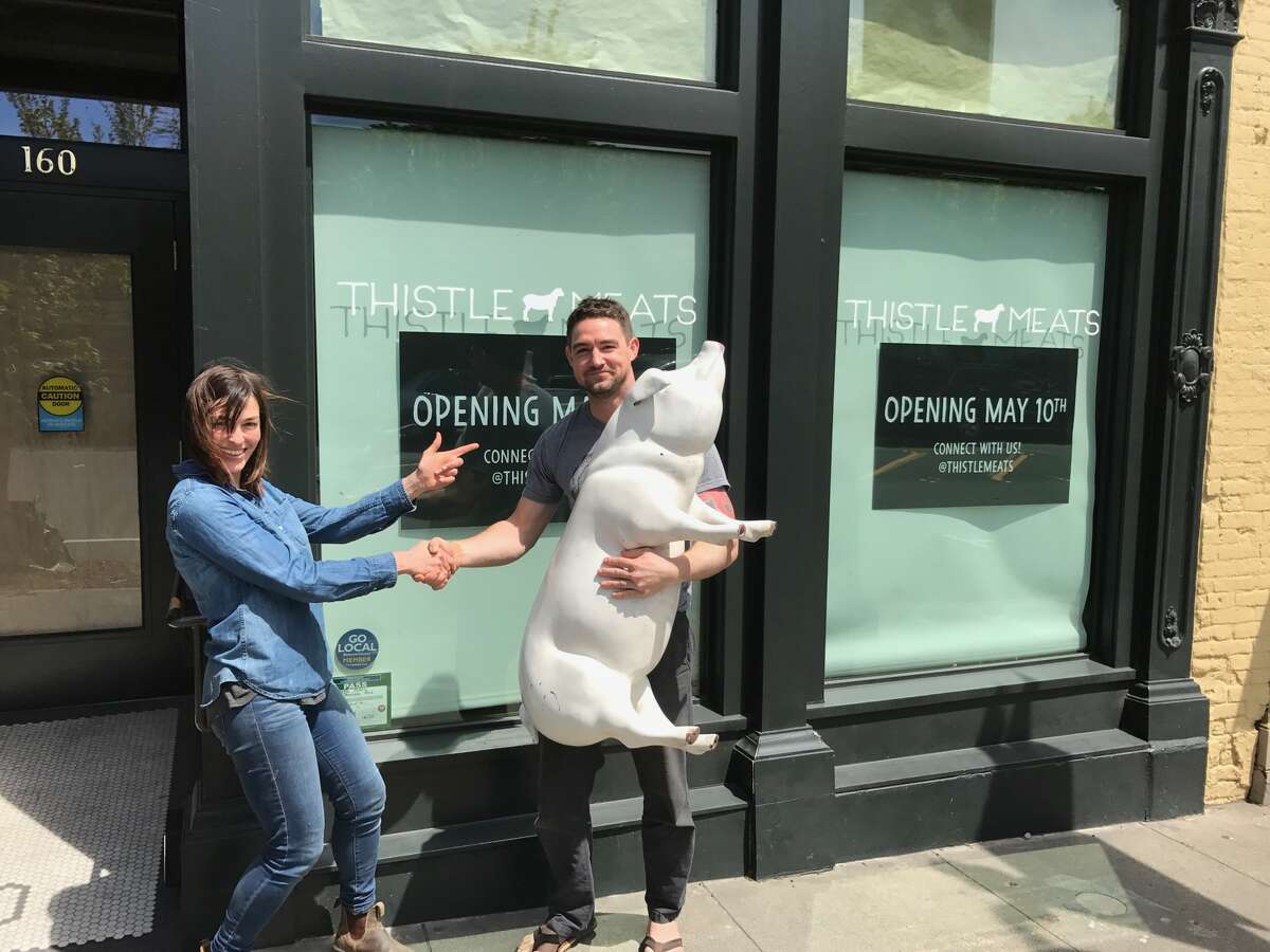 Former Thistle Meats owner Molly Best and Travis Day stand in front of the Thistle Meats butcher shop and restaurant. Photo courtesy of Thistle Meats